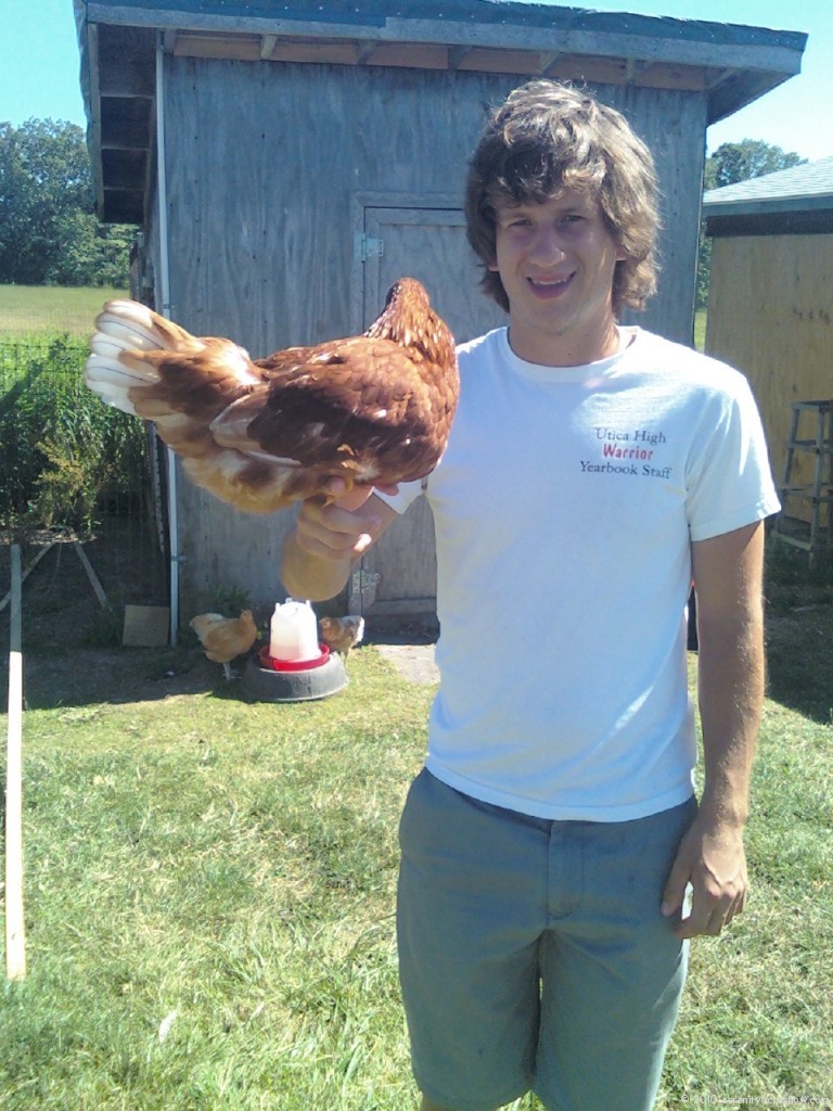 My brother Danny and one of our ISA Brown Hens